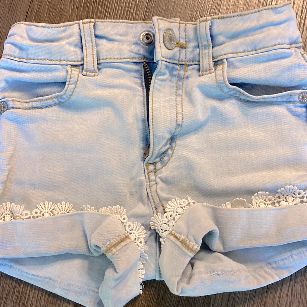 High rise denim light blue shorts.